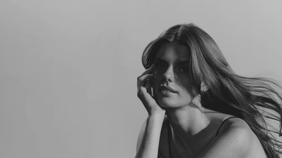 A model, showing hair styled by Hair Rituel by Sisley