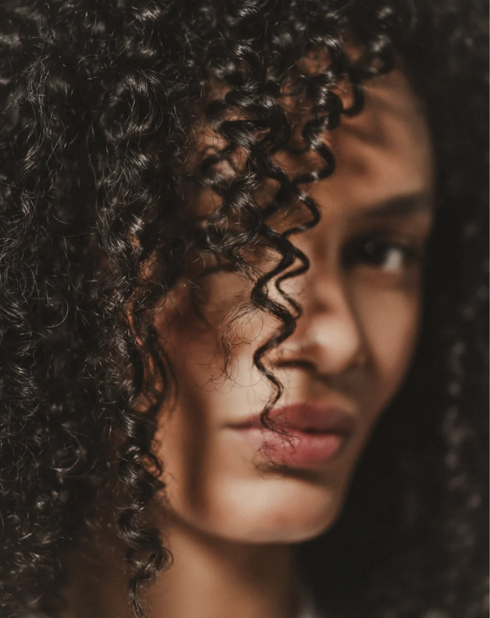 Hair Rituel model with tightly curled hair
