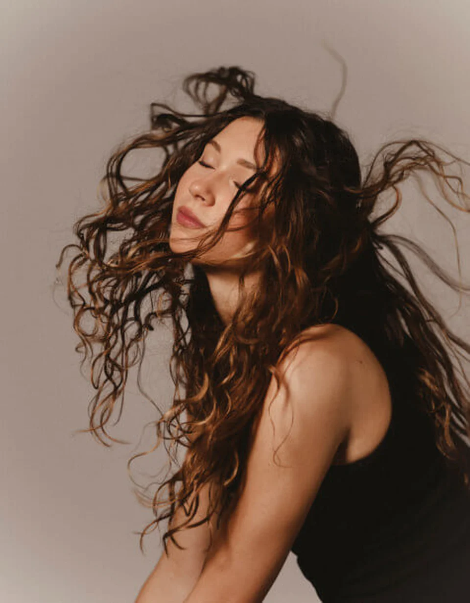 Hair Rituel model with tightly curled hair