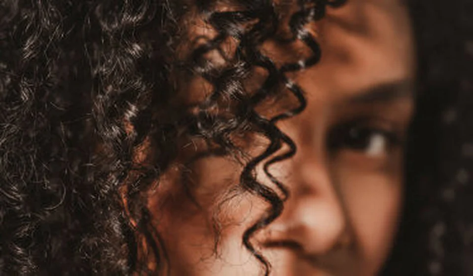 Hair Rituel model with tightly curled hair