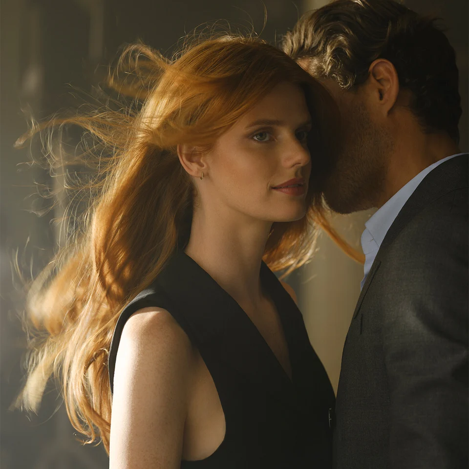 Man breathing in Hair Rituel by Sisley Le Parfum on a woman’s neck