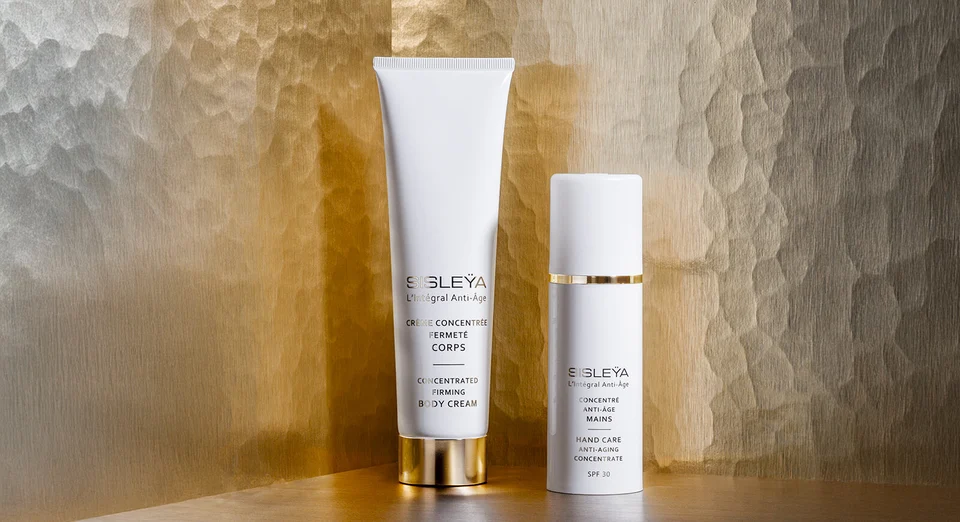 Product visuals: Sisleÿa L'Intégral Anti-Âge Concentrated Firming Body Cream and the Hand Care Anti-Aging Concentrate