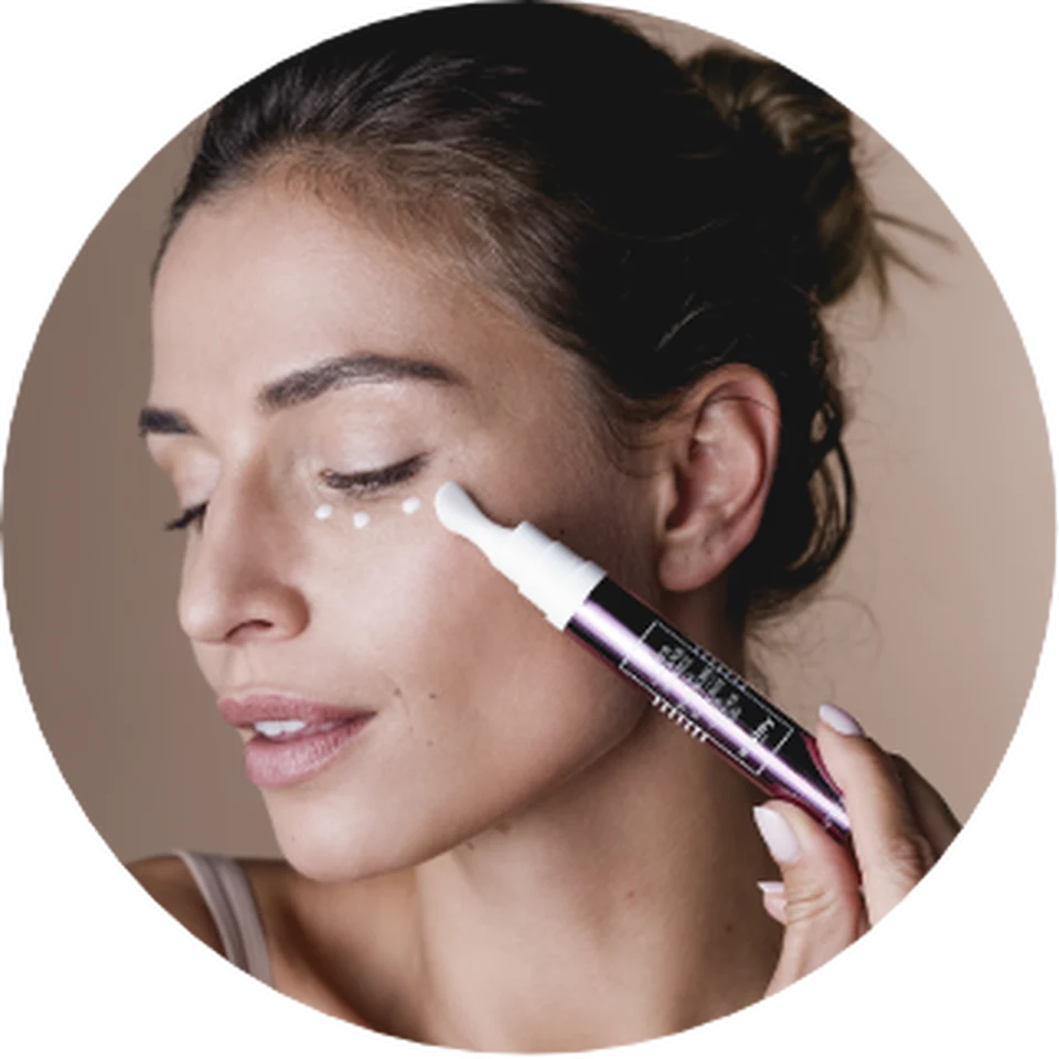 Woman applying Black Rose Eye Contour Fluid