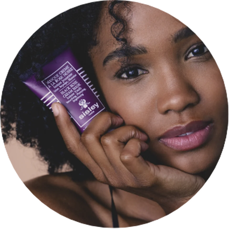 Woman showing the Black Rose Cream Mask
